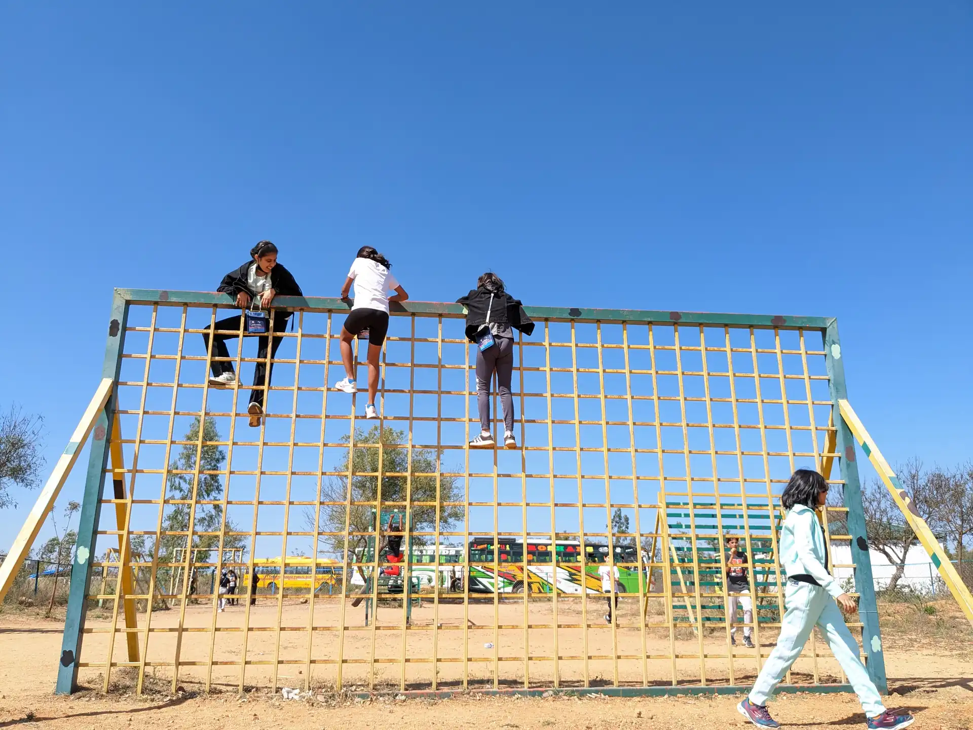 Team working through a cargo-net teamwork obstacle